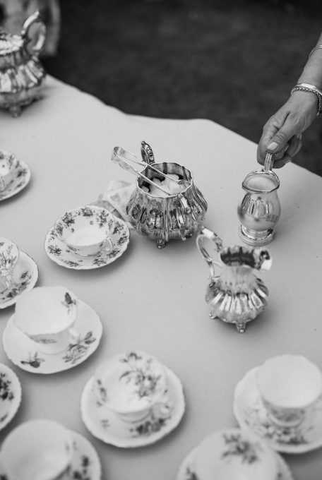 Fine china tea cups and silverware at elegant wedding Ana Galloway Photography