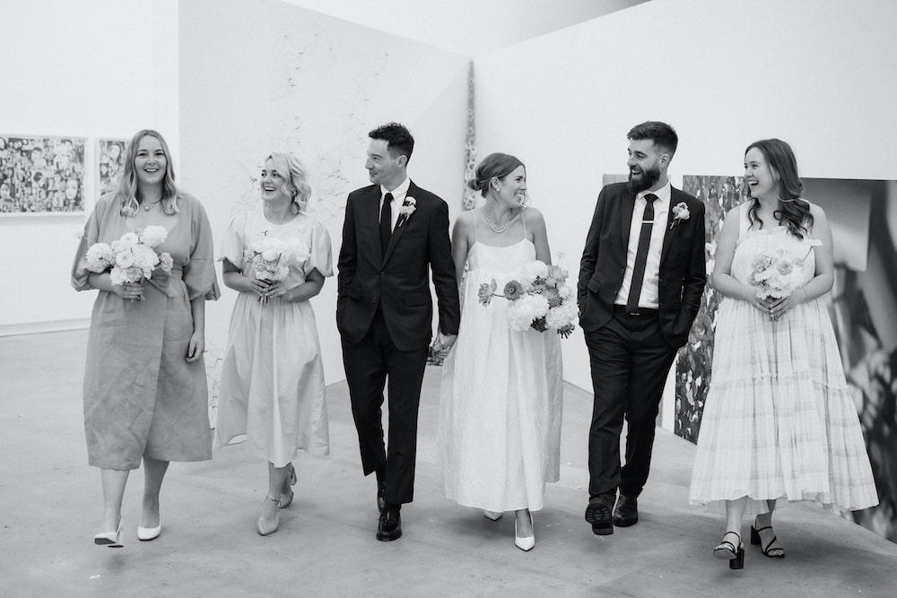 Bride and groom and bridal party in art gallery Christchurch Wedding Ana Galloway Photography